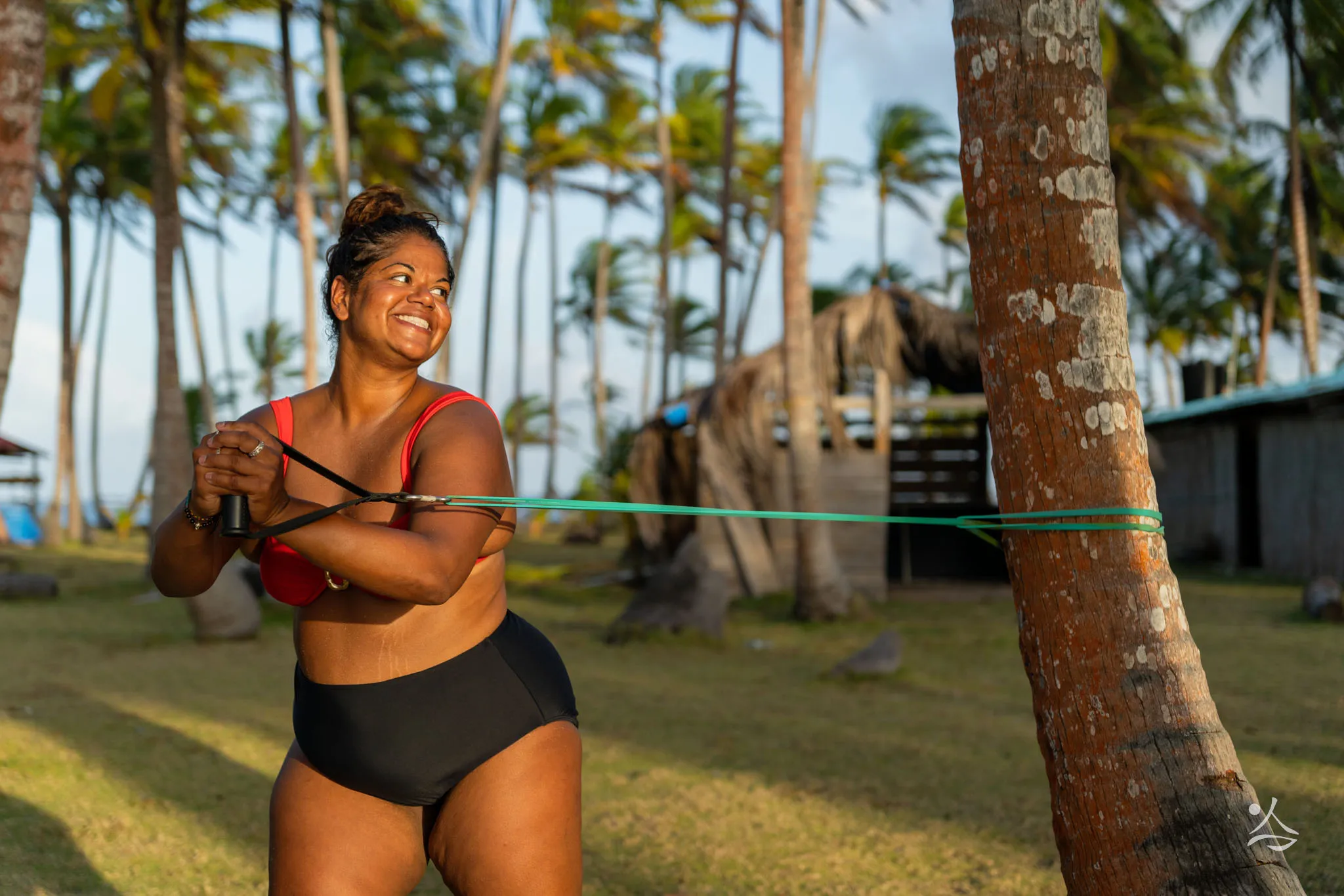Resistance band training under the palm trees