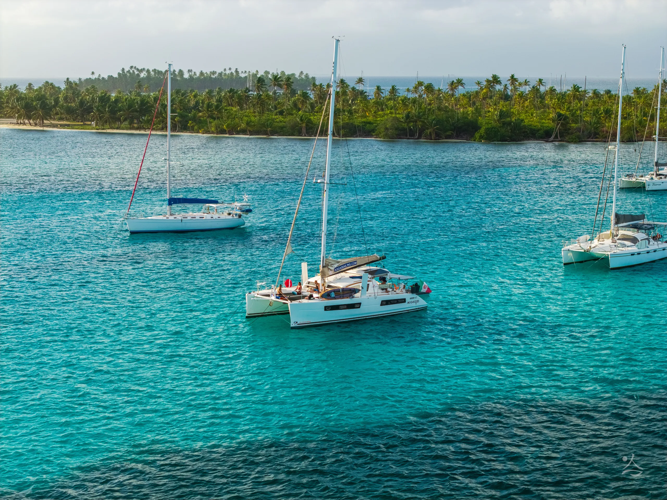 The catamaran Ikigai at anchor off a San Blas island, seen from above